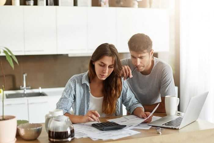 Couple checking their budget for packing and moving